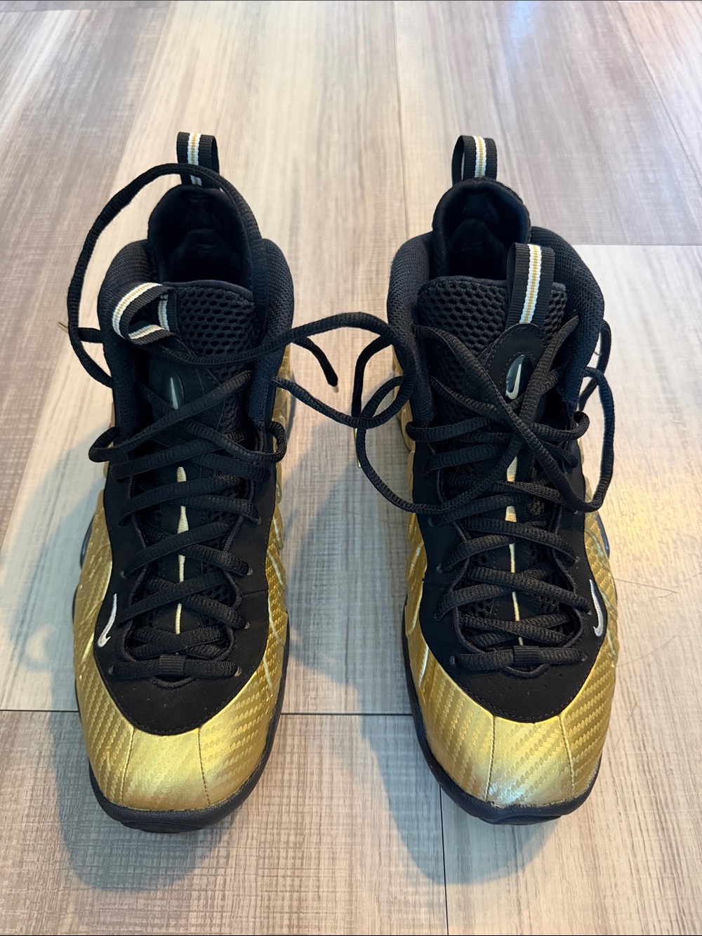 Nike Black and Gold Foamposite High-Top Sneakers